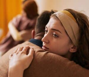 People Embracing at a Family Therapy Session