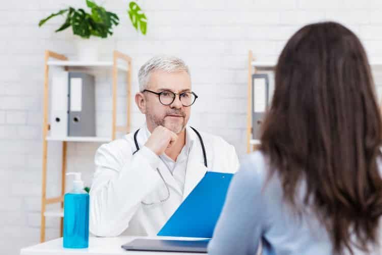 Consultation with family doctor in modern clinic
